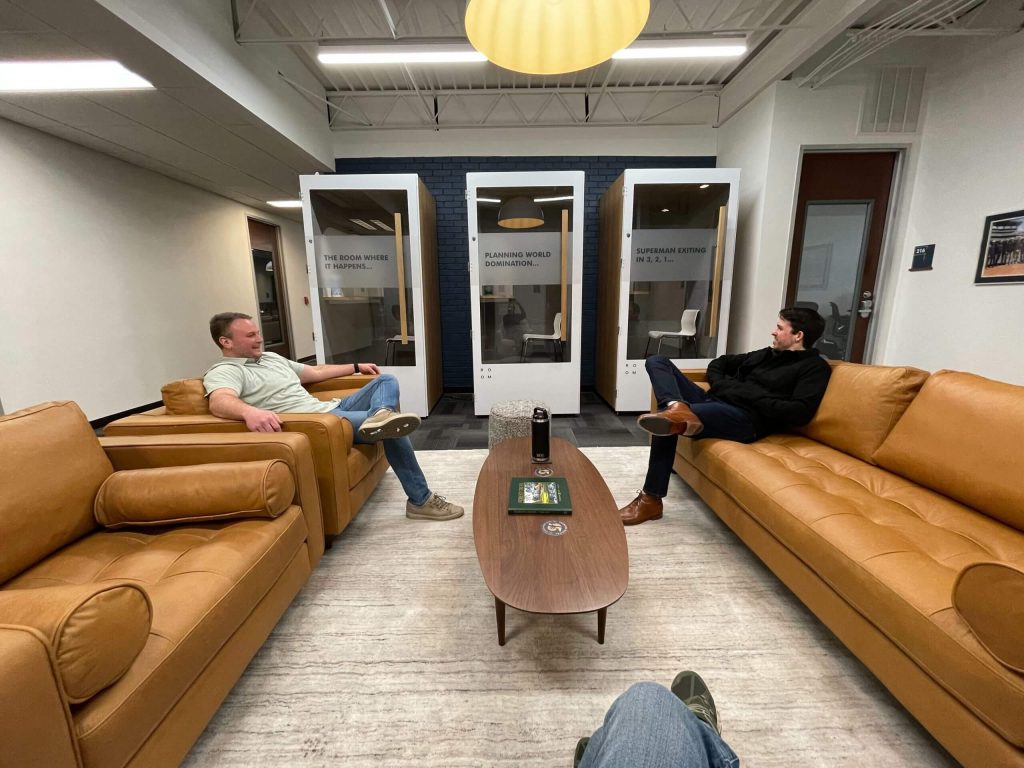 two Trimark employees enjoying the new lounge space