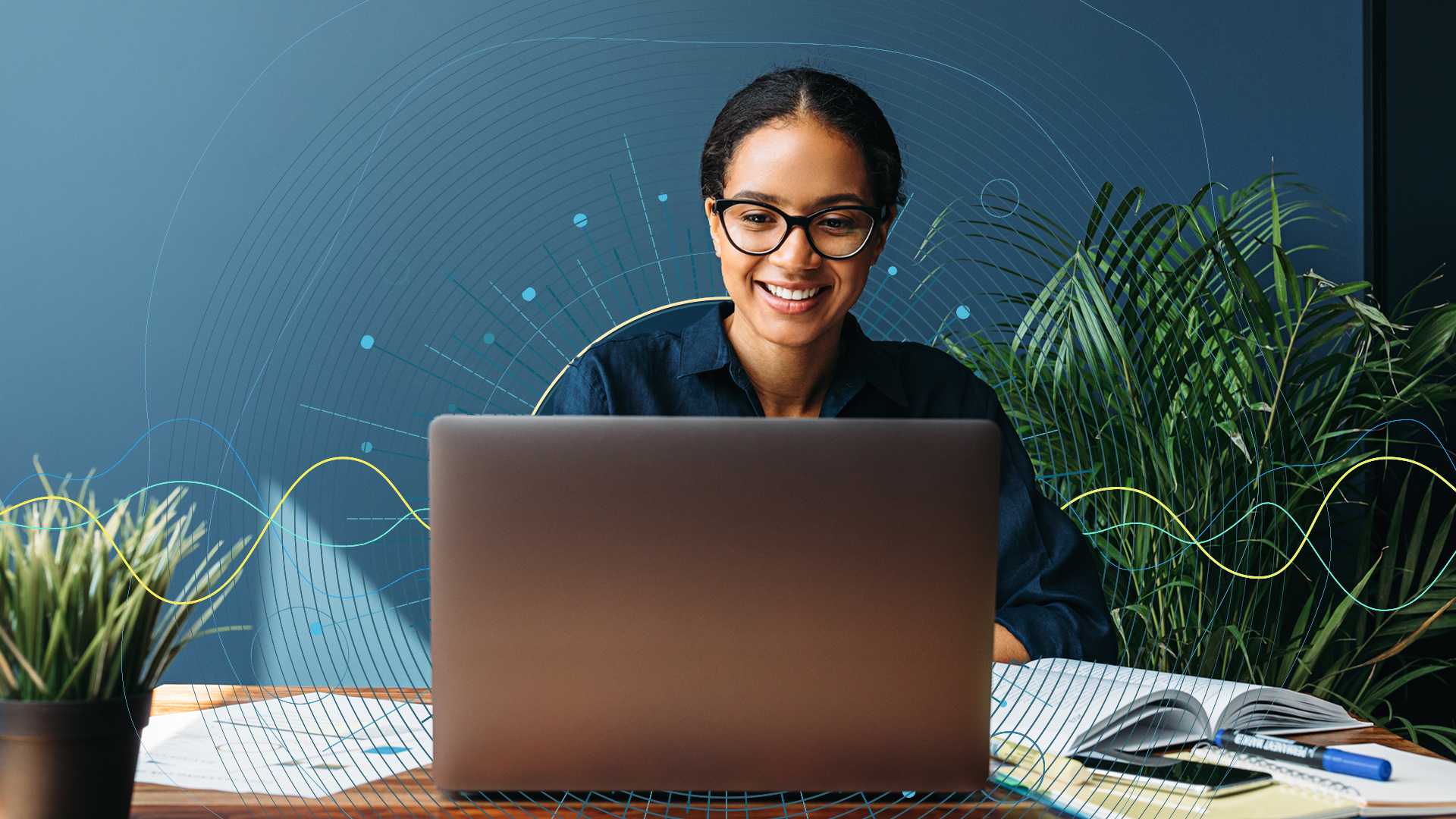 Female working with graphics around her computer